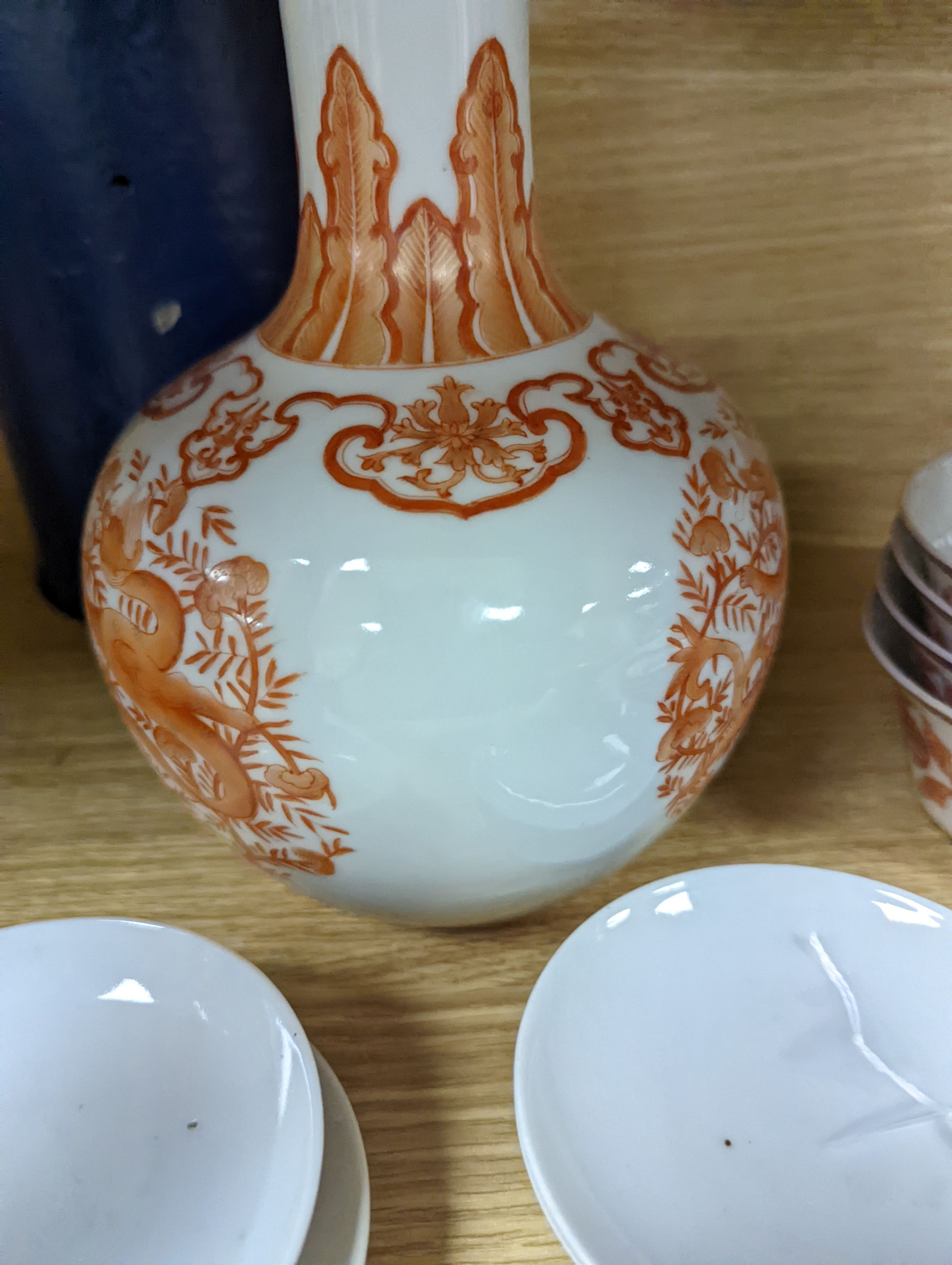 A set of five Chinese teabowls, covers and stands and a similar 'dragon' vase, 23cm